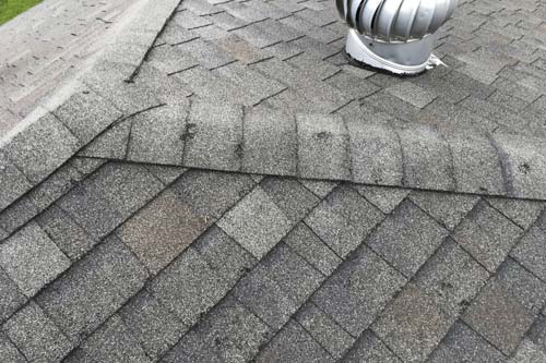 Hail damaged roofing shingles